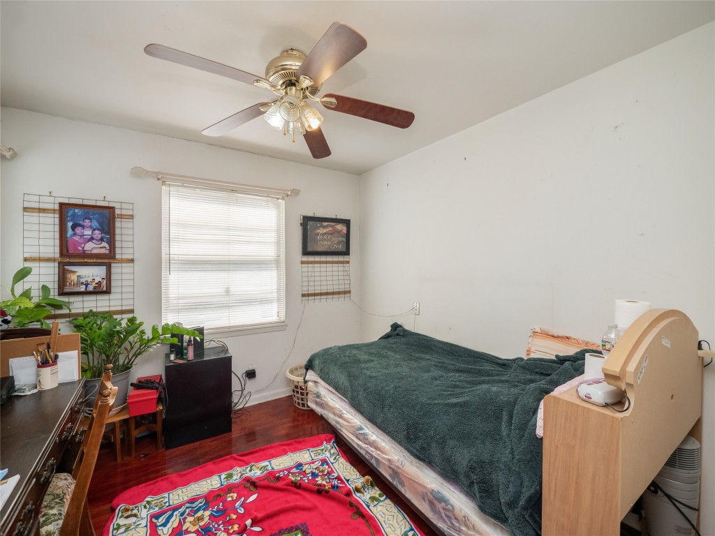 1409 Zephyr Road Killeen, TX 76541 - Photo 16 of 31 a bedroom with a bed and a chandelier