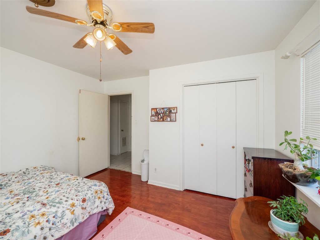 1409 Zephyr Road Killeen, TX 76541 - Photo 20 of 31 a bedroom with a bed chandelier and a window