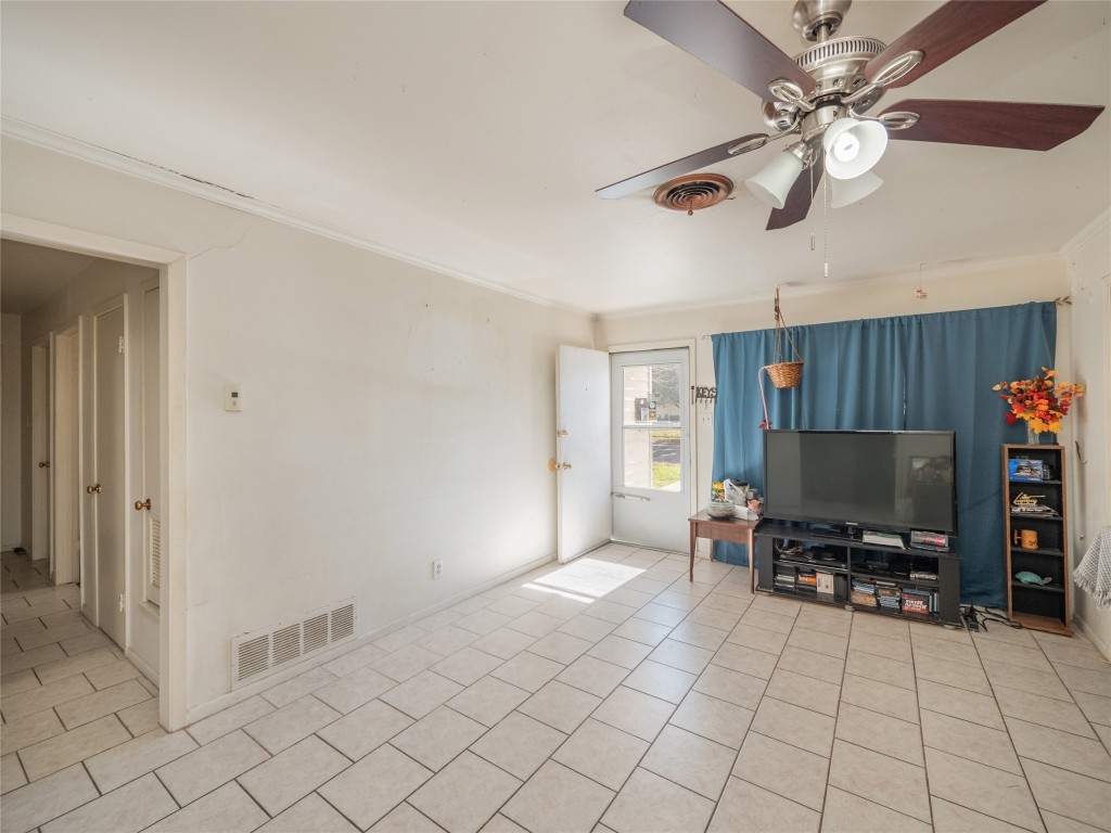 1409 Zephyr Road Killeen, TX 76541 - Photo 6 of 31 a living room with furniture and a flat screen tv