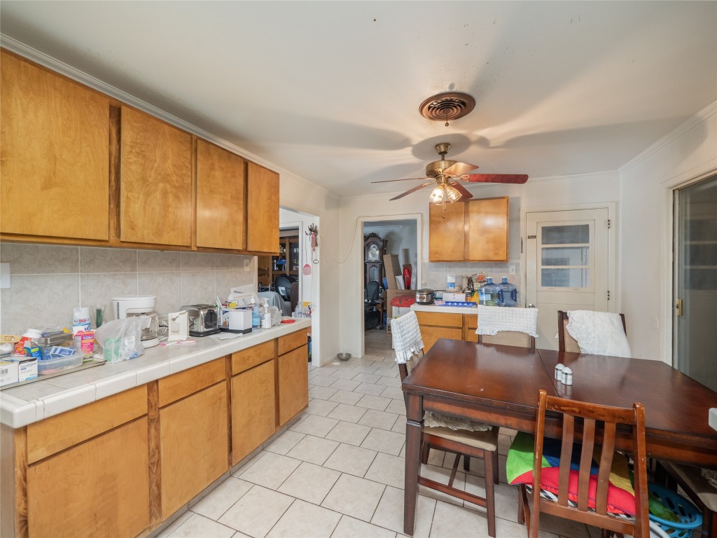 1409 Zephyr Road Killeen, TX 76541 - Photo 9 of 31 a open kitchen with stainless steel appliances granite countertop a stove and a refrigerator