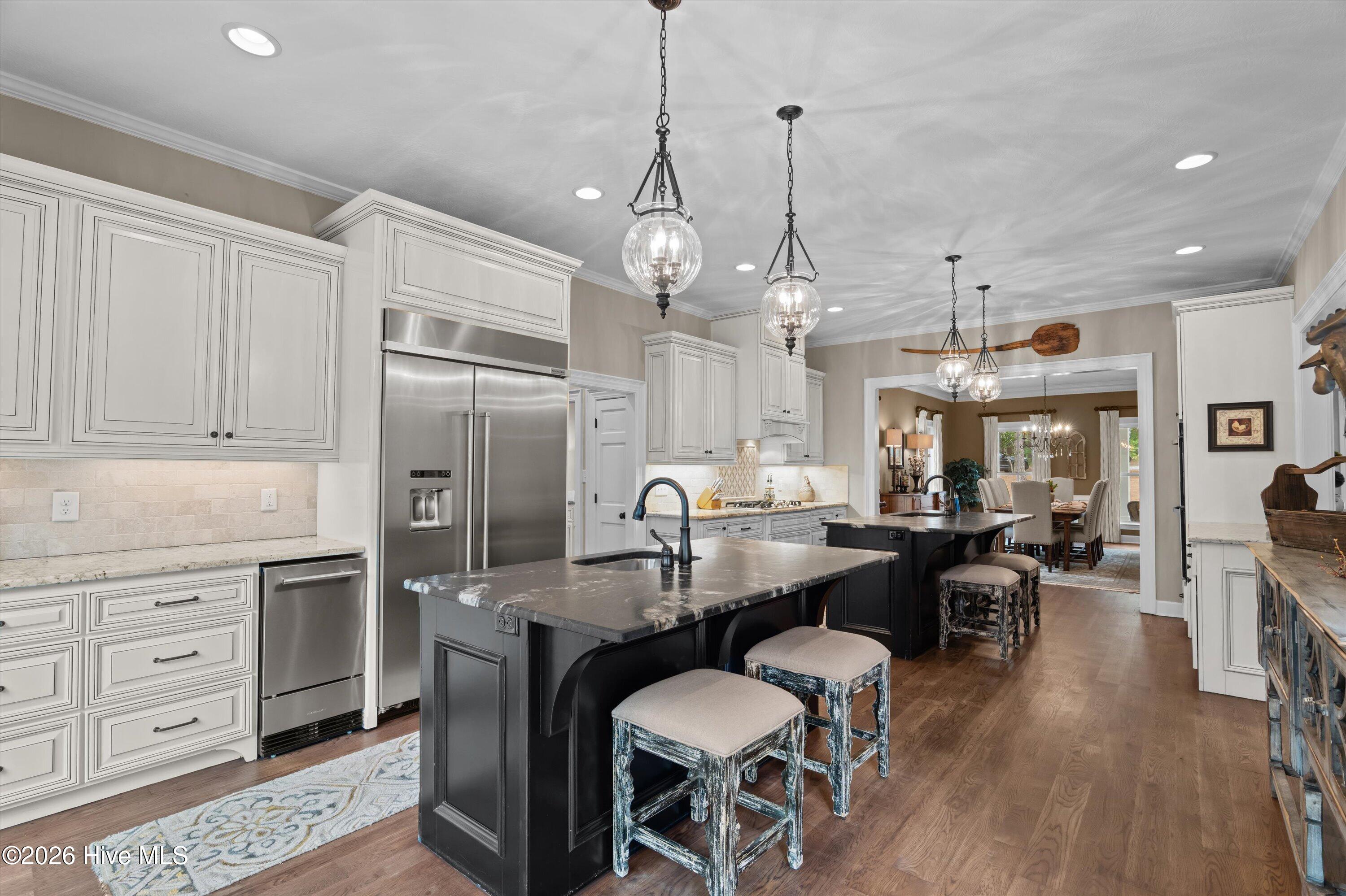6218 Columbia Road Appling, GA 30802 - Photo 22 of 97 Incredible chef's kitchen with 2 islands, gas cooktop, double oven, and ice machine.