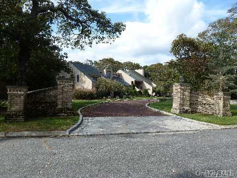 a view of street with house in background