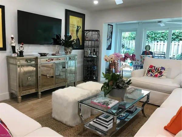 a living room with furniture and a flat screen tv