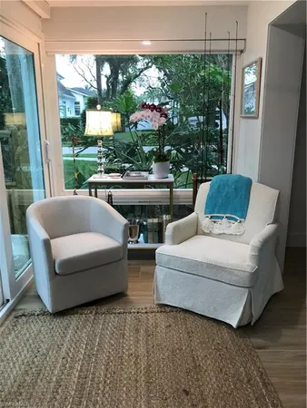 a backyard of a house with table and chairs