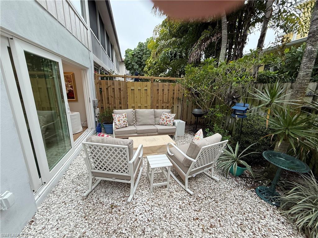 302 2nd Street South, Unit 302 Naples, FL 34102 - Photo 14 of 14 a view of a patio with a chairs in a patio