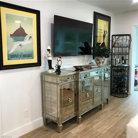 a kitchen with stainless steel appliances a stove and a microwave