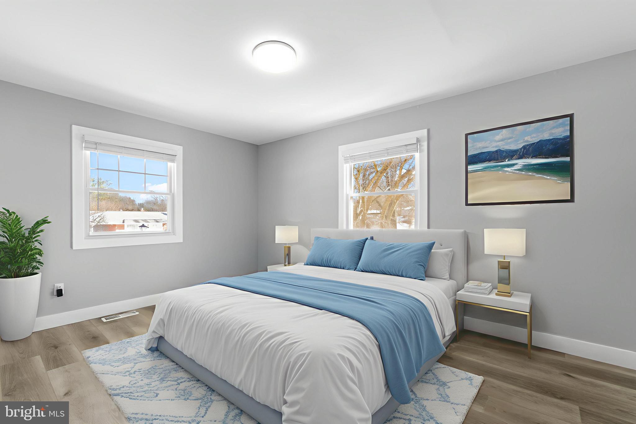 19104 Bloomfield Road Olney, MD 20832 - Photo 15 of 37 a bedroom with a bed and a painting on the wall