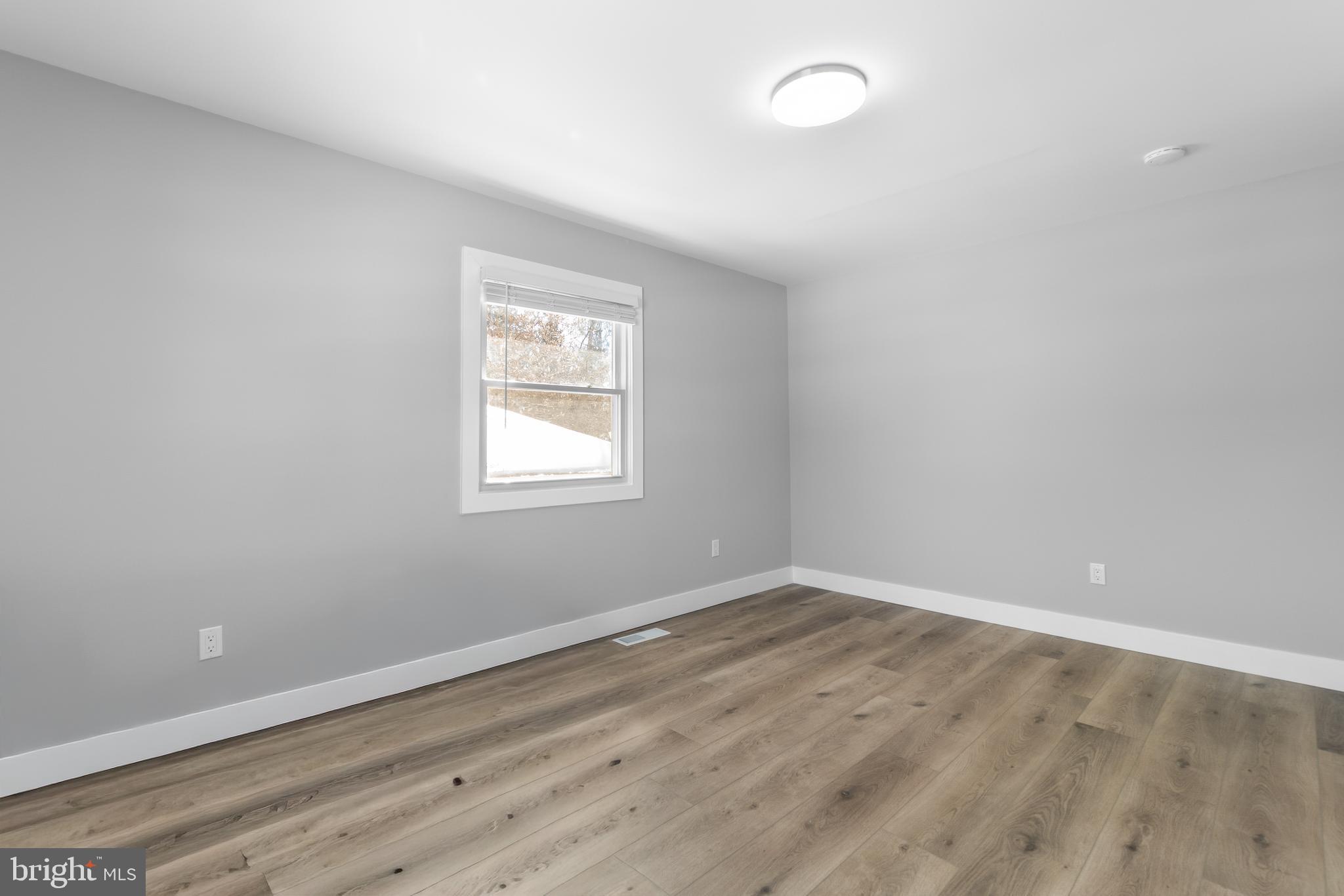 19104 Bloomfield Road Olney, MD 20832 - Photo 17 of 37 wooden floor in an empty room with a window