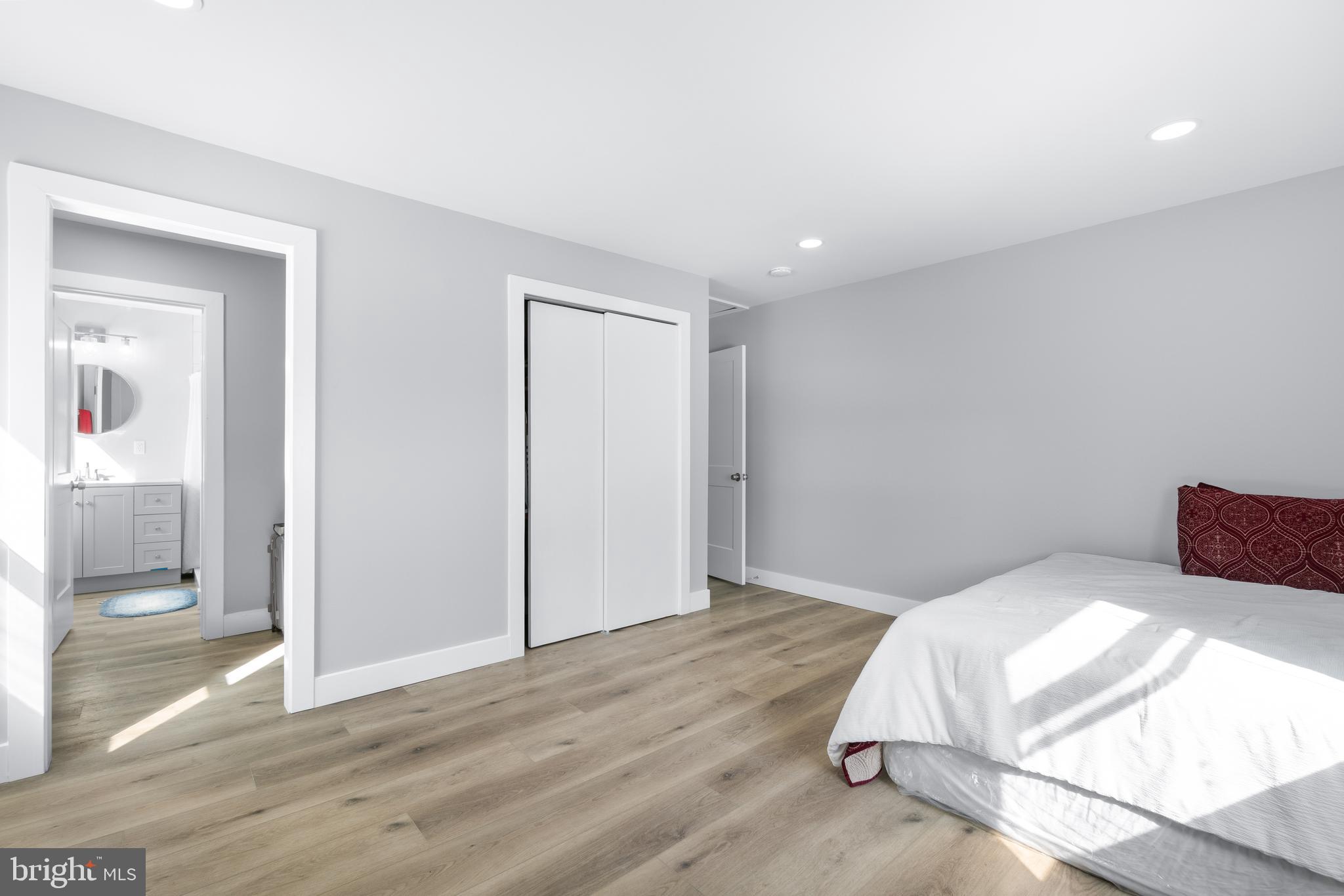 19104 Bloomfield Road Olney, MD 20832 - Photo 20 of 37 a bedroom with a bed and glass door