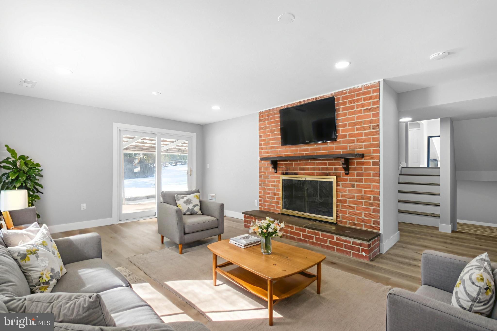 19104 Bloomfield Road Olney, MD 20832 - Photo 23 of 37 a living room with furniture or fireplace and a flat screen tv