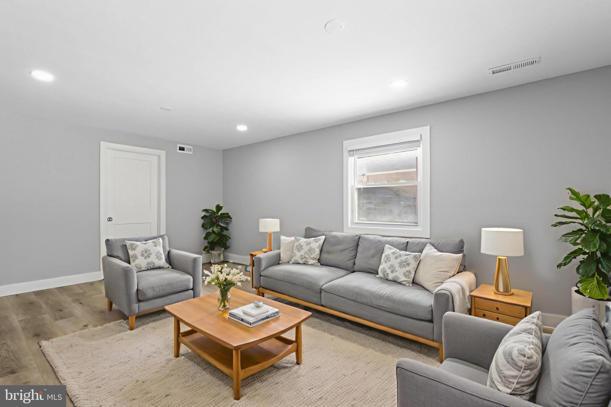 19104 Bloomfield Road Olney, MD 20832 - Photo 25 of 37 a living room with furniture a rug and a window