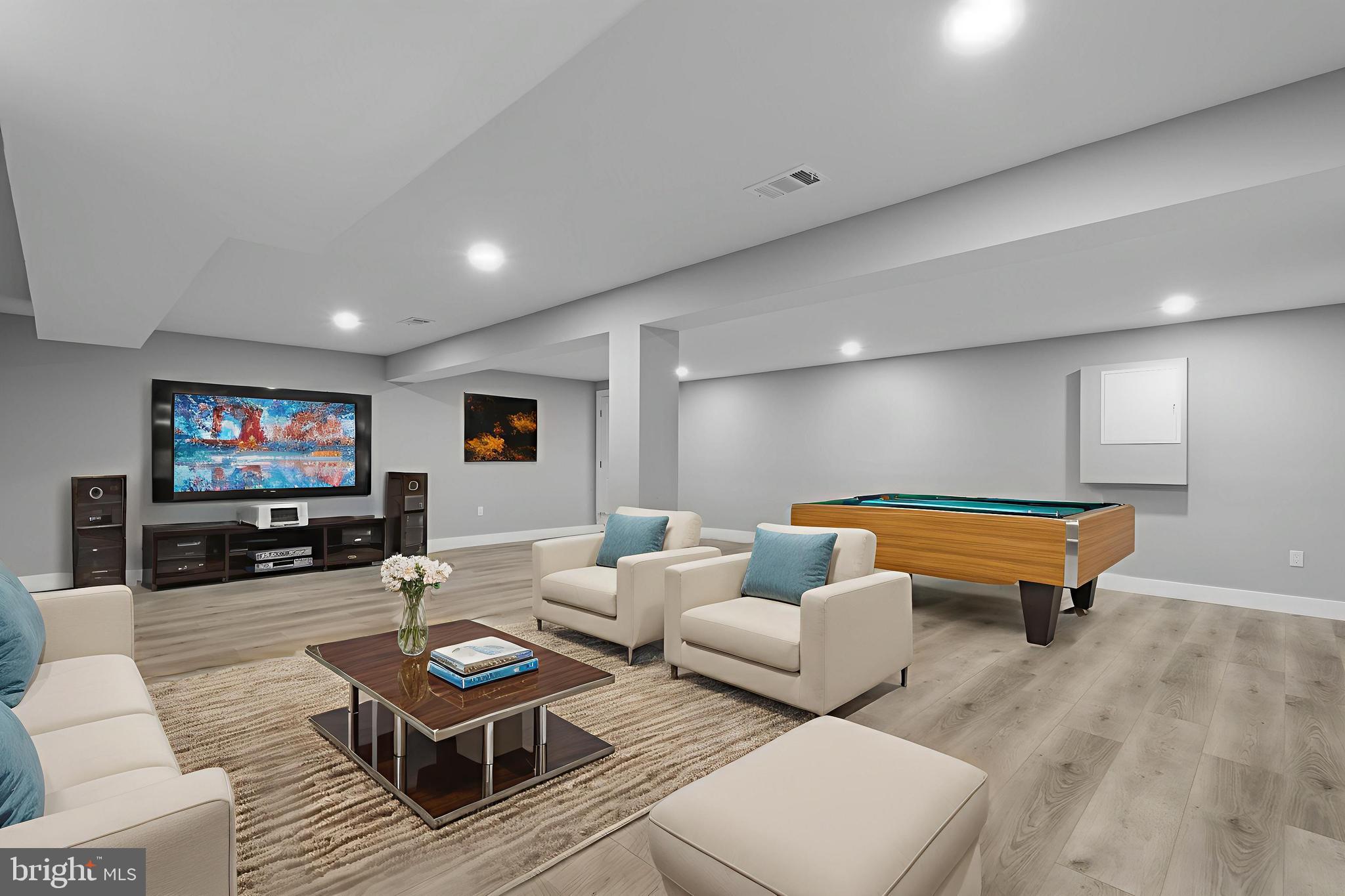 19104 Bloomfield Road Olney, MD 20832 - Photo 28 of 37 a living room with furniture and a flat screen tv