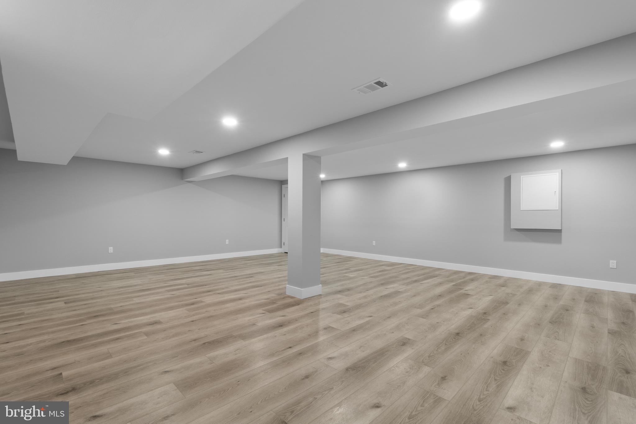 19104 Bloomfield Road Olney, MD 20832 - Photo 29 of 37 a view of an empty room with wooden floor and a window