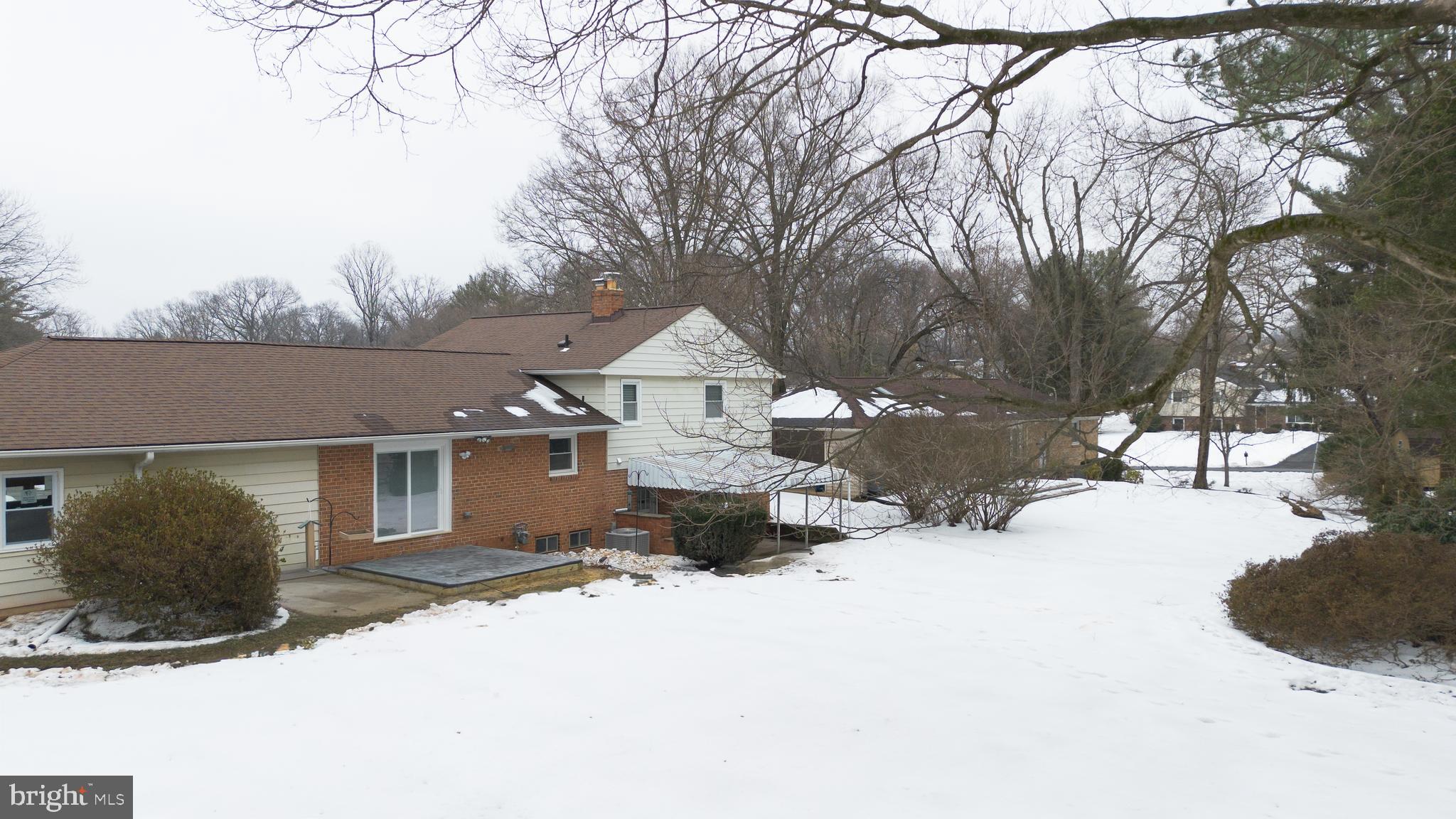 19104 Bloomfield Road Olney, MD 20832 - Photo 33 of 37 a view of a house with a snow in the yard
