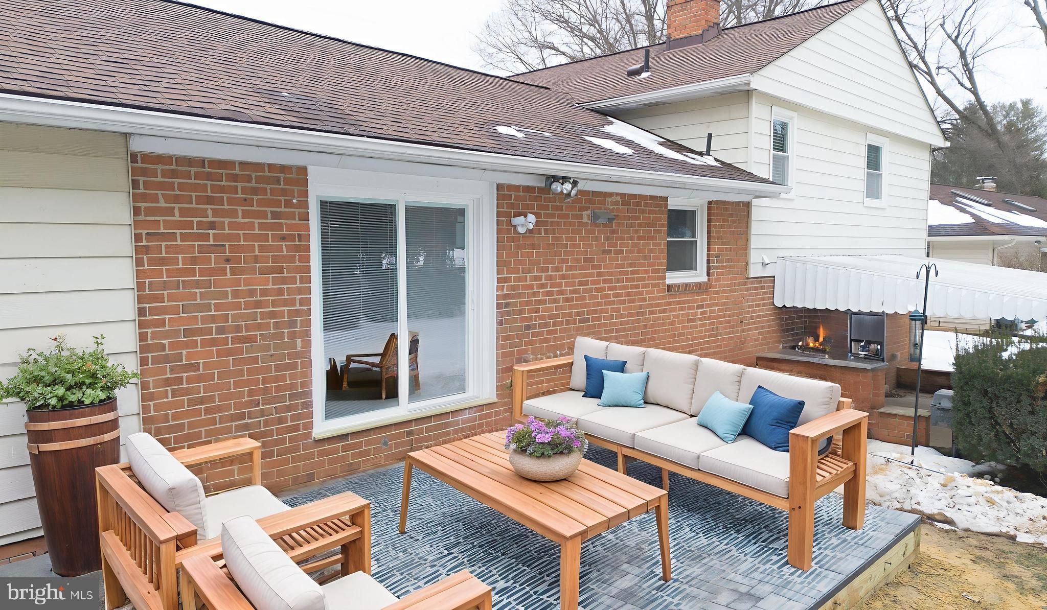 19104 Bloomfield Road Olney, MD 20832 - Photo 34 of 37 a view of a patio with couches table and chairs and potted plants