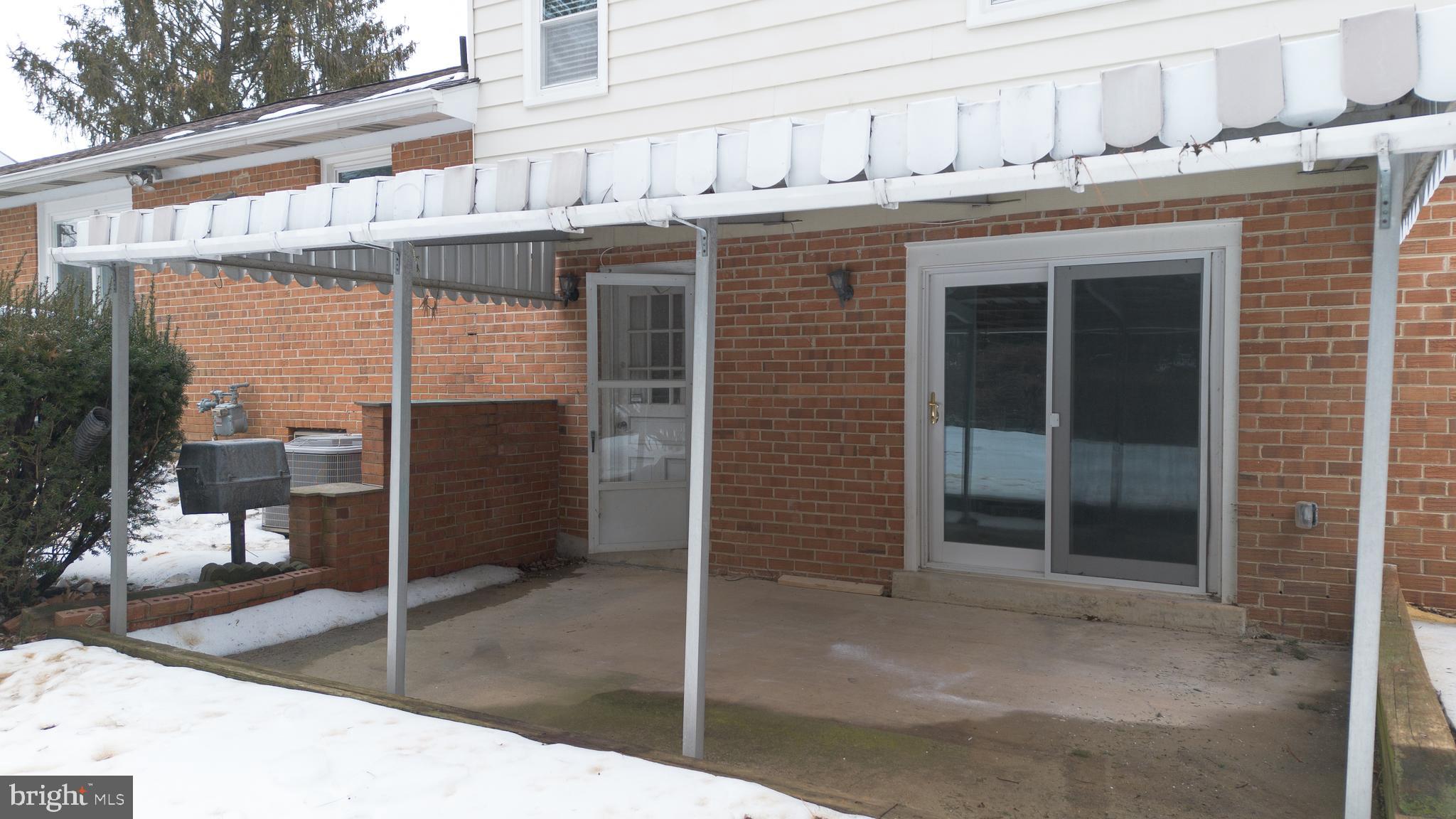19104 Bloomfield Road Olney, MD 20832 - Photo 36 of 37 a front view of a building with glass door