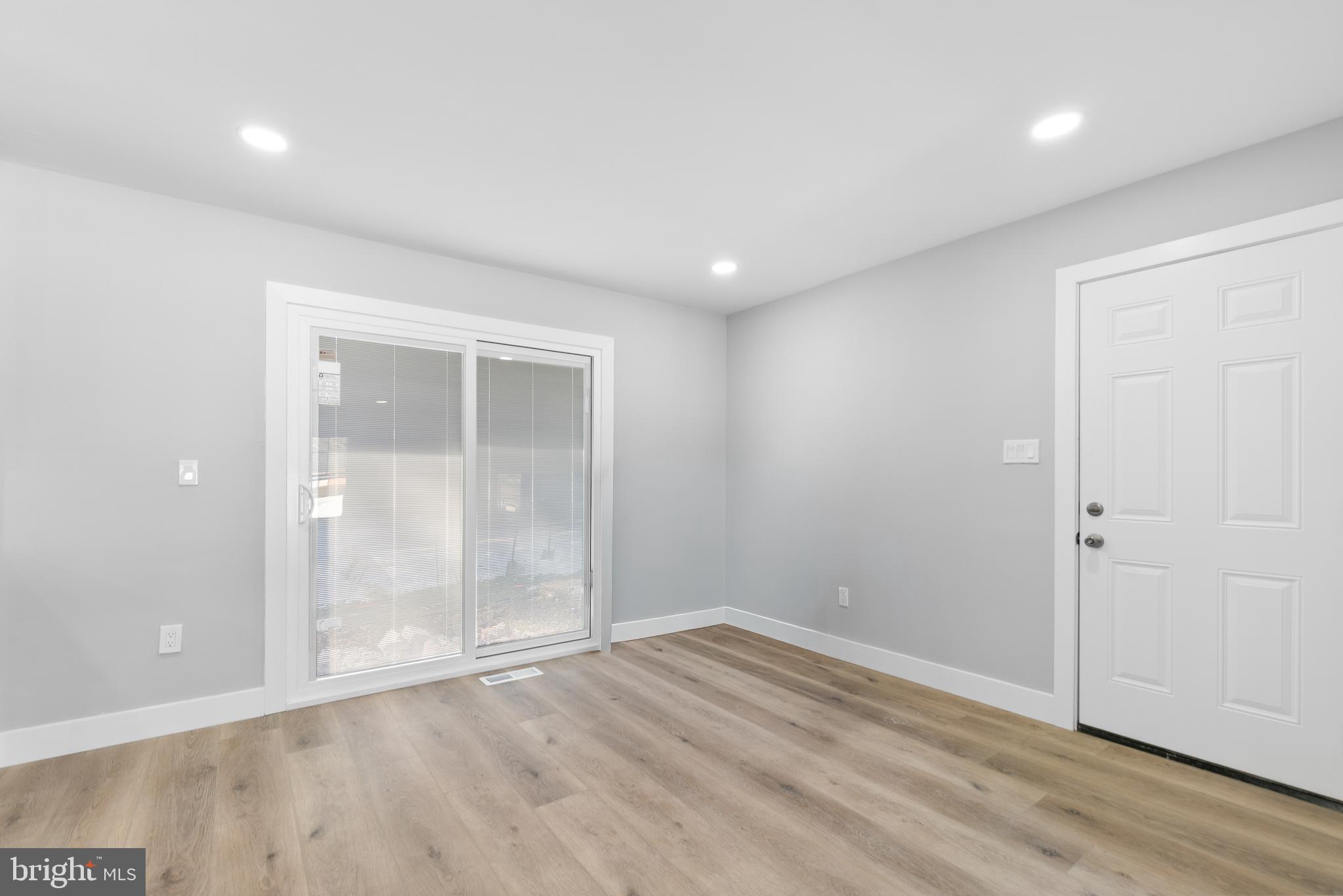 19104 Bloomfield Road Olney, MD 20832 - Photo 7 of 37 an empty room with wooden floor and closet