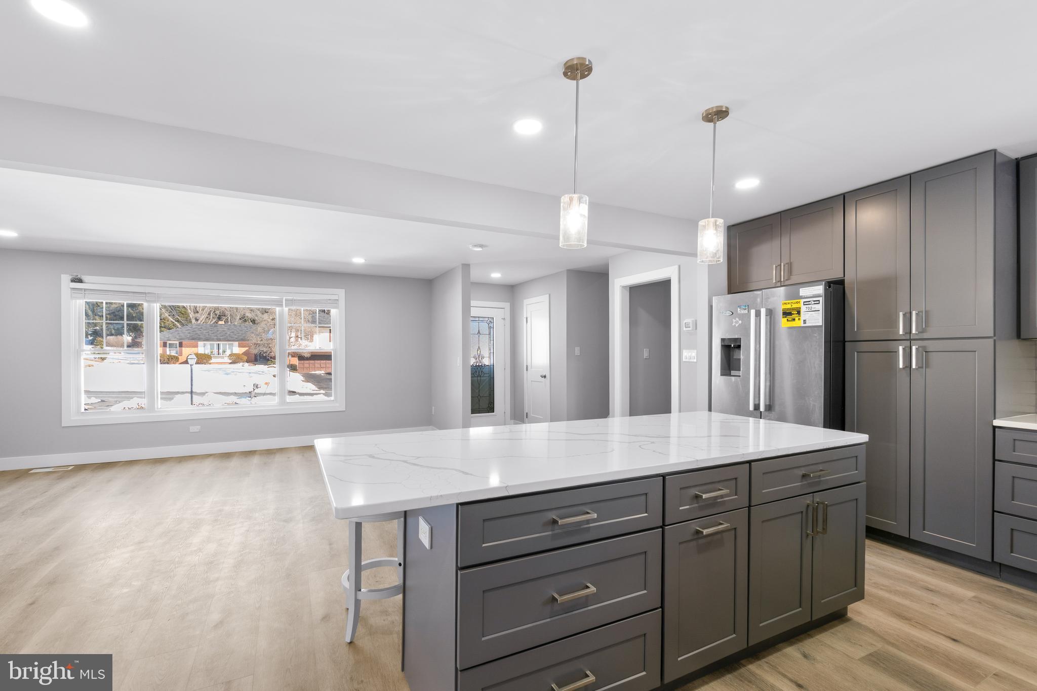 19104 Bloomfield Road Olney, MD 20832 - Photo 10 of 37 a spacious bathroom with a granite countertop sink mirror and refrigerator