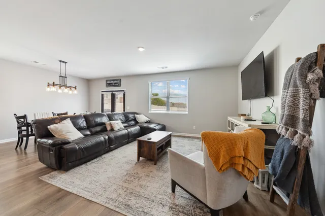 a living room with furniture window and wooden floor