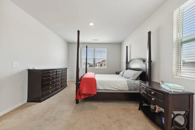 a bathroom with a glass shower door a bathtub a sink and a mirror