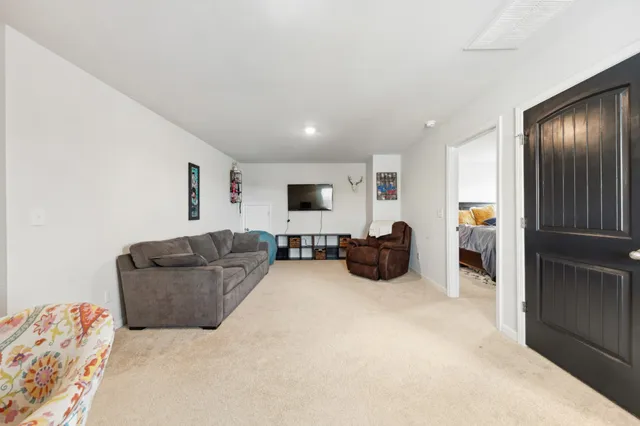 a bedroom with a bed and a chair