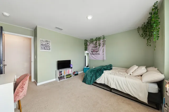 a view of a swimming pool with a lawn chairs under an umbrella