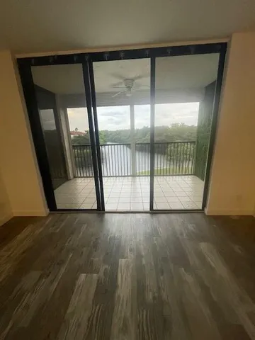 a view of a kitchen with a sink and a window