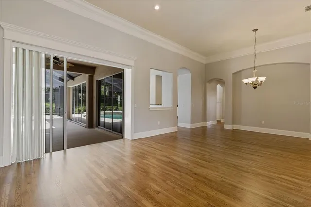 a view of a room with wooden floor