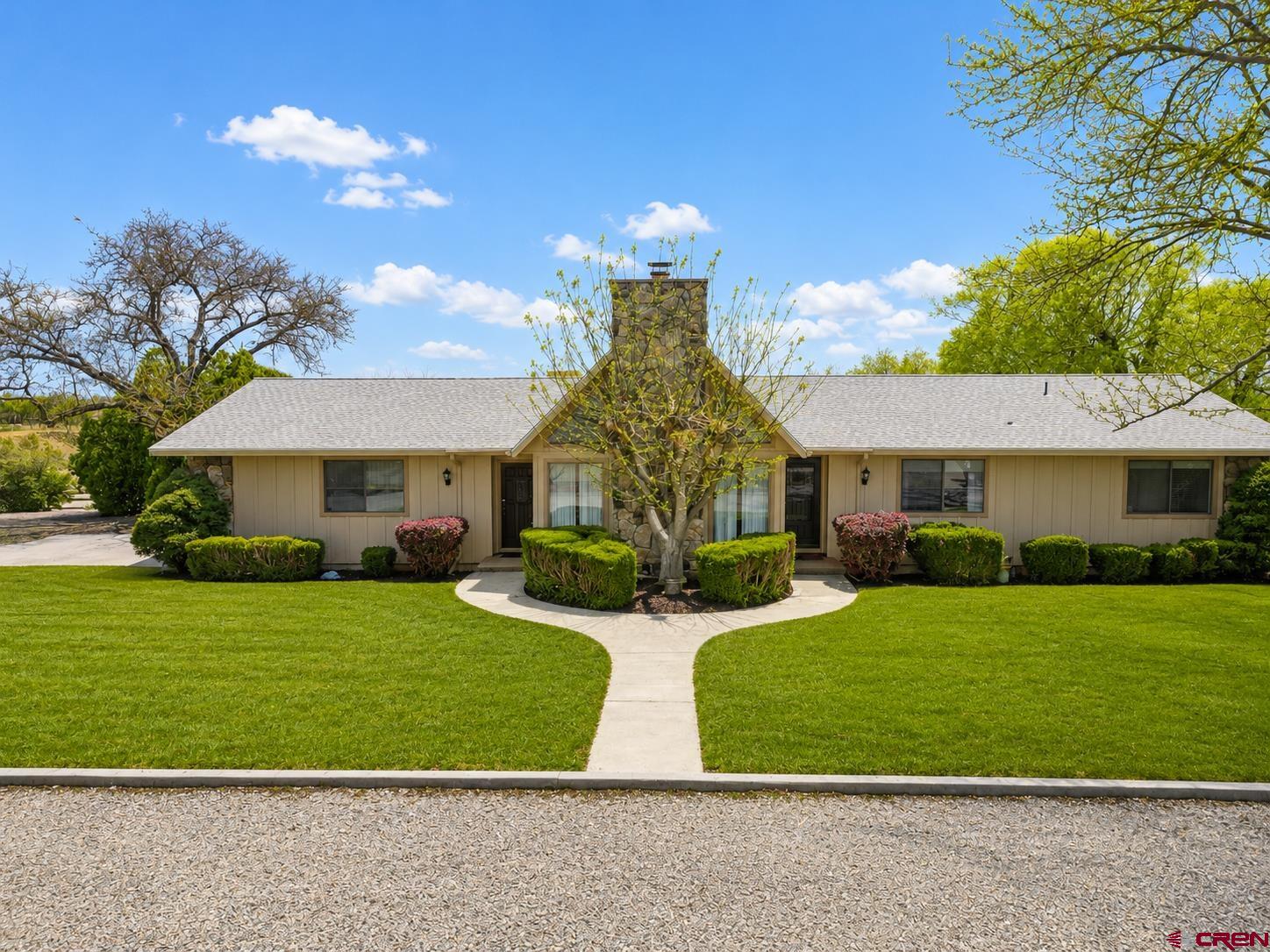 2323 Pioneer Road Delta, CO 81416 - Photo 1 of 35 a view of a house with a yard and potted plants