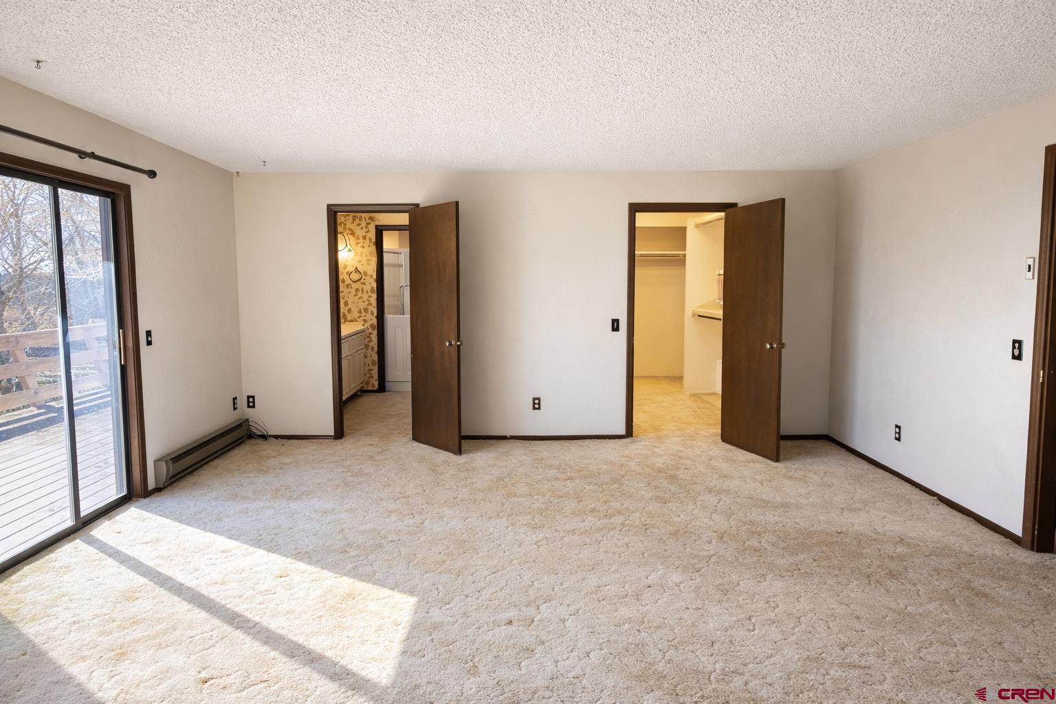 2323 Pioneer Road Delta, CO 81416 - Photo 17 of 35 an empty room with windows and closet