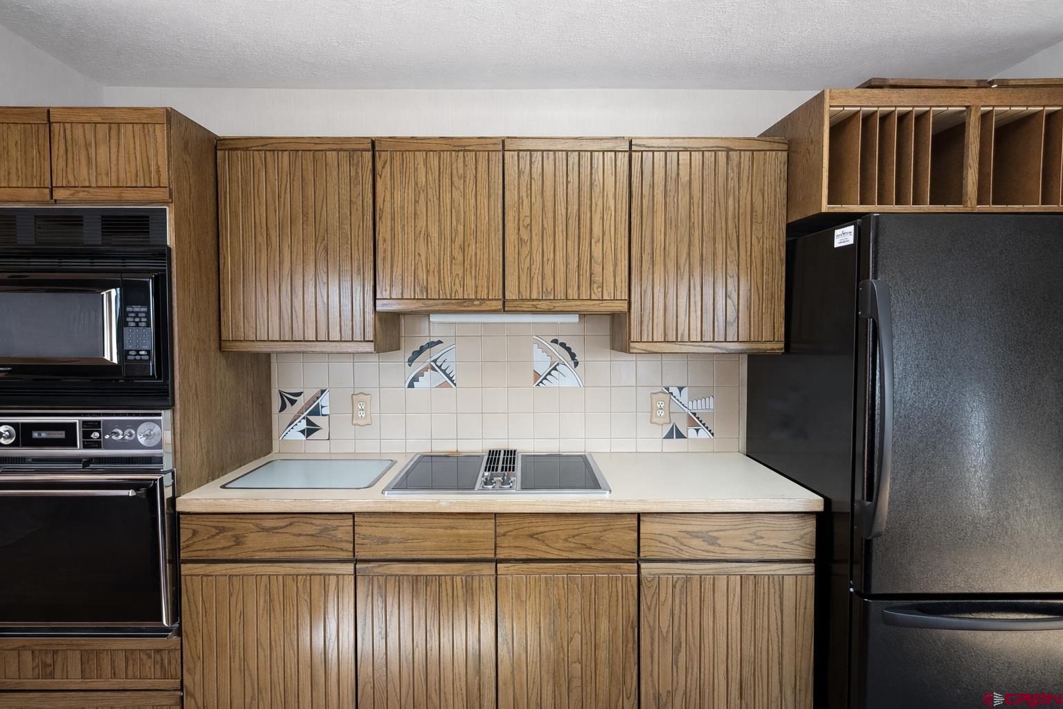 2323 Pioneer Road Delta, CO 81416 - Photo 10 of 35 a kitchen with a sink a stove and refrigerator