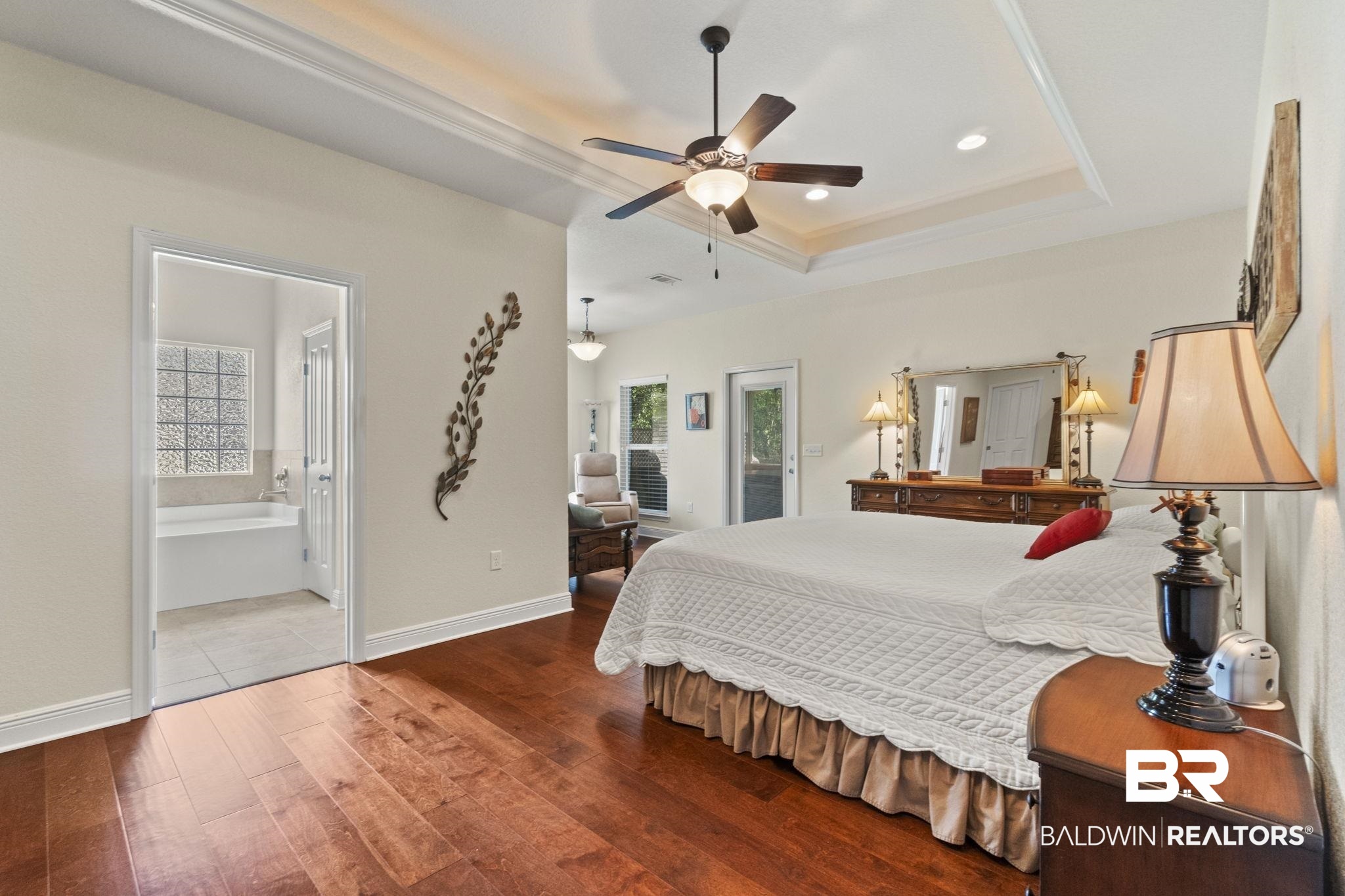 8664 Foxtail Loop Pensacola, FL 32526 - Photo 32 of 64 Bedroom with wood-type flooring, a raised ceiling, recessed lighting, baseboards, and ceiling fan