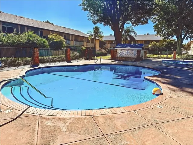a view of a swimming pool with a patio