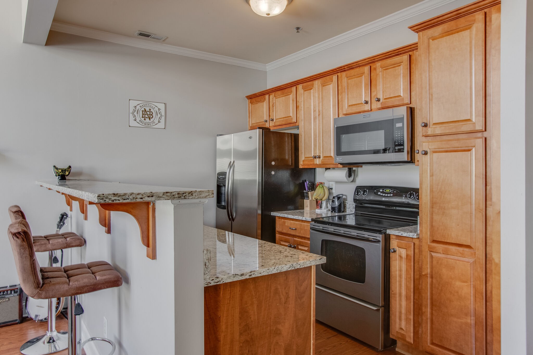 2010 Birch Lane Spring Hill, TN 37174 - Photo 12 of 25 a kitchen with granite countertop a refrigerator stove and microwave