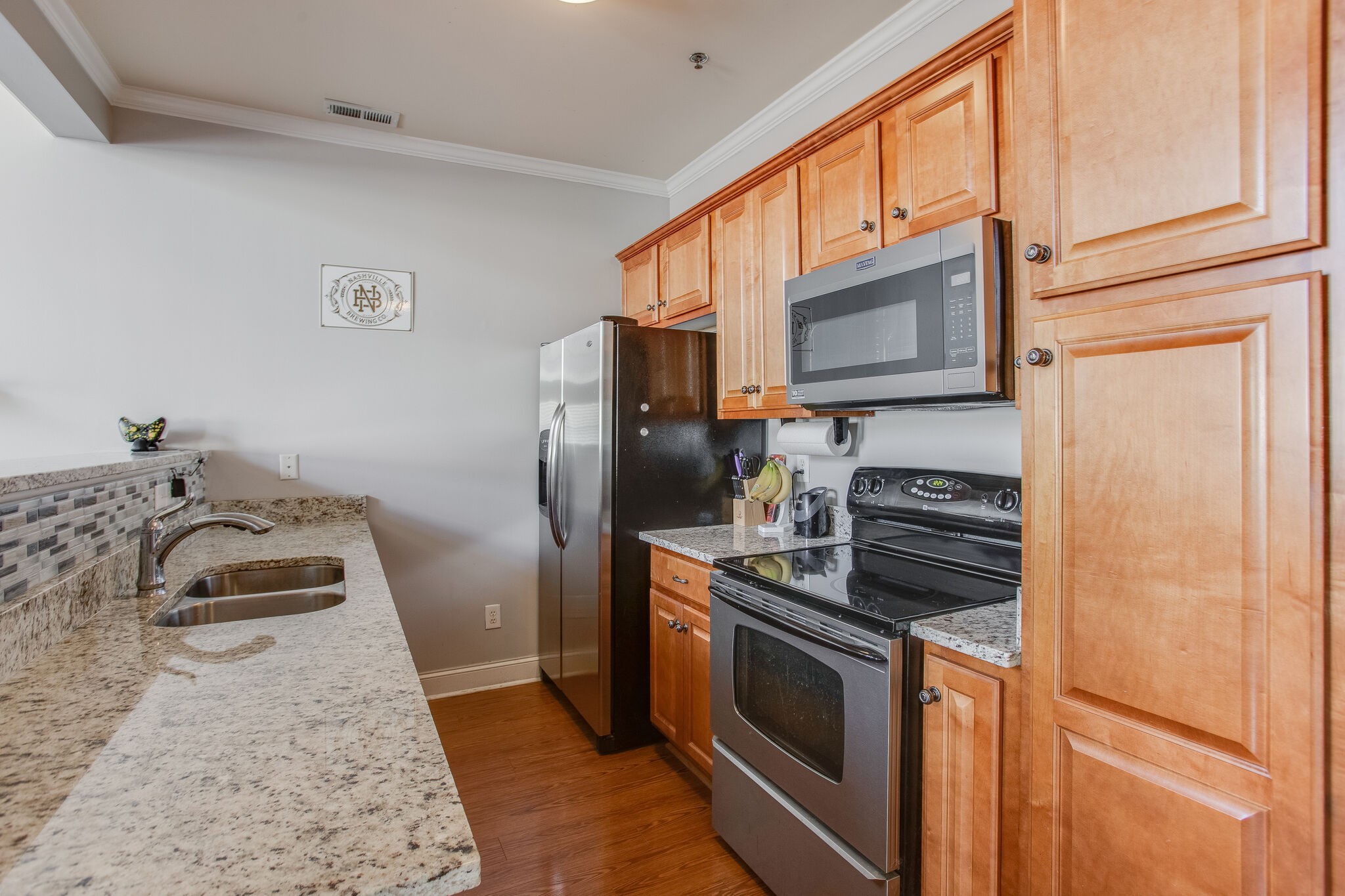 2010 Birch Lane Spring Hill, TN 37174 - Photo 5 of 25 a kitchen with stainless steel appliances granite countertop a stove a refrigerator and a microwave