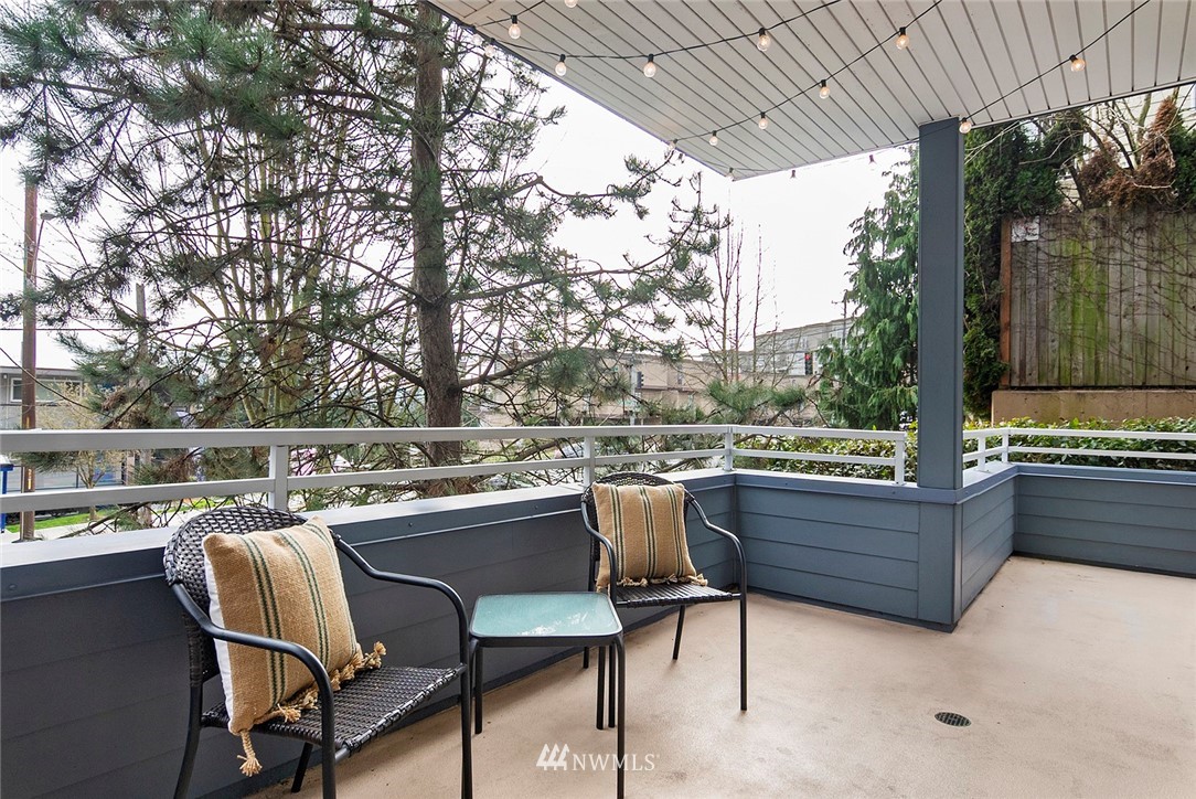 3112 Southwest Avalon Way, Unit 102 Seattle, WA 98126 - Photo 16 of 26 a patio with table and chairs