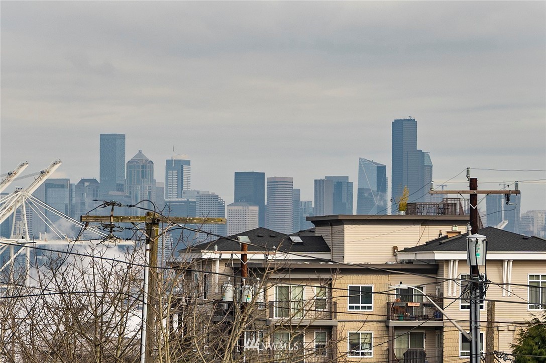 3112 Southwest Avalon Way, Unit 102 Seattle, WA 98126 - Photo 19 of 26 a city view with buildings