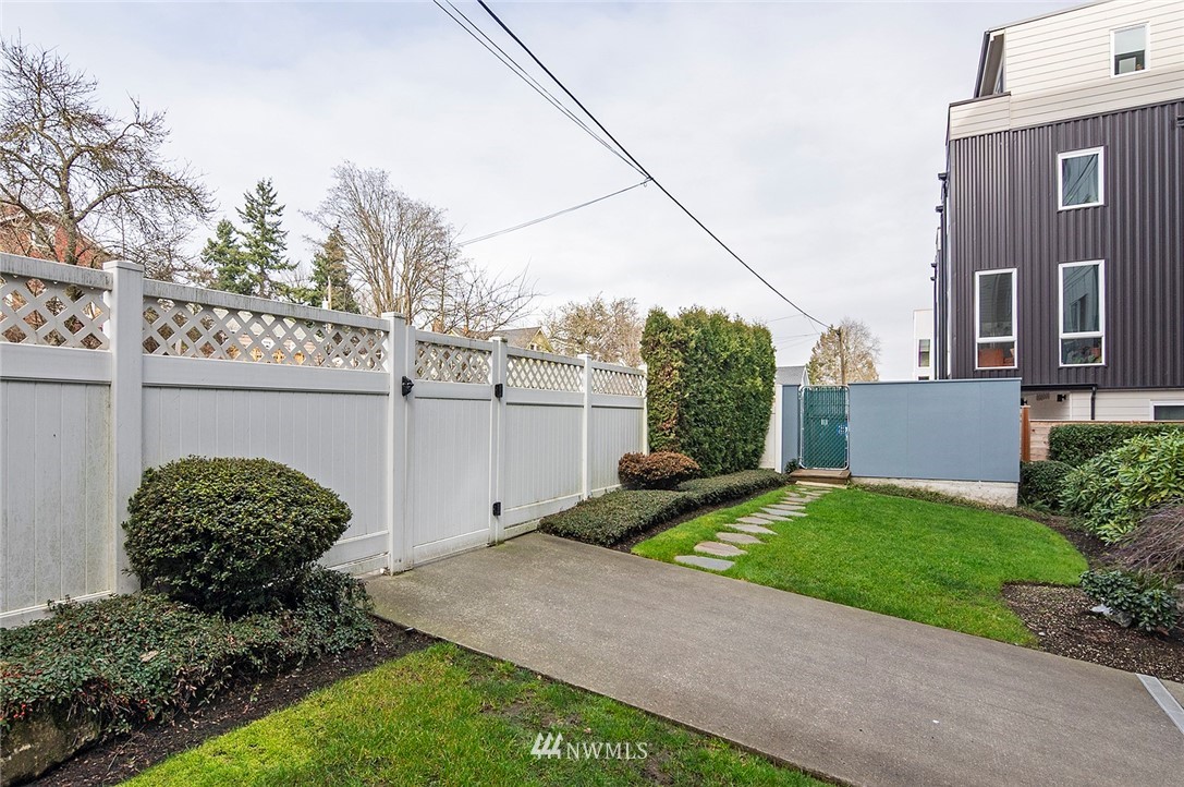 3112 Southwest Avalon Way, Unit 102 Seattle, WA 98126 - Photo 22 of 26 a view of a back yard of the house