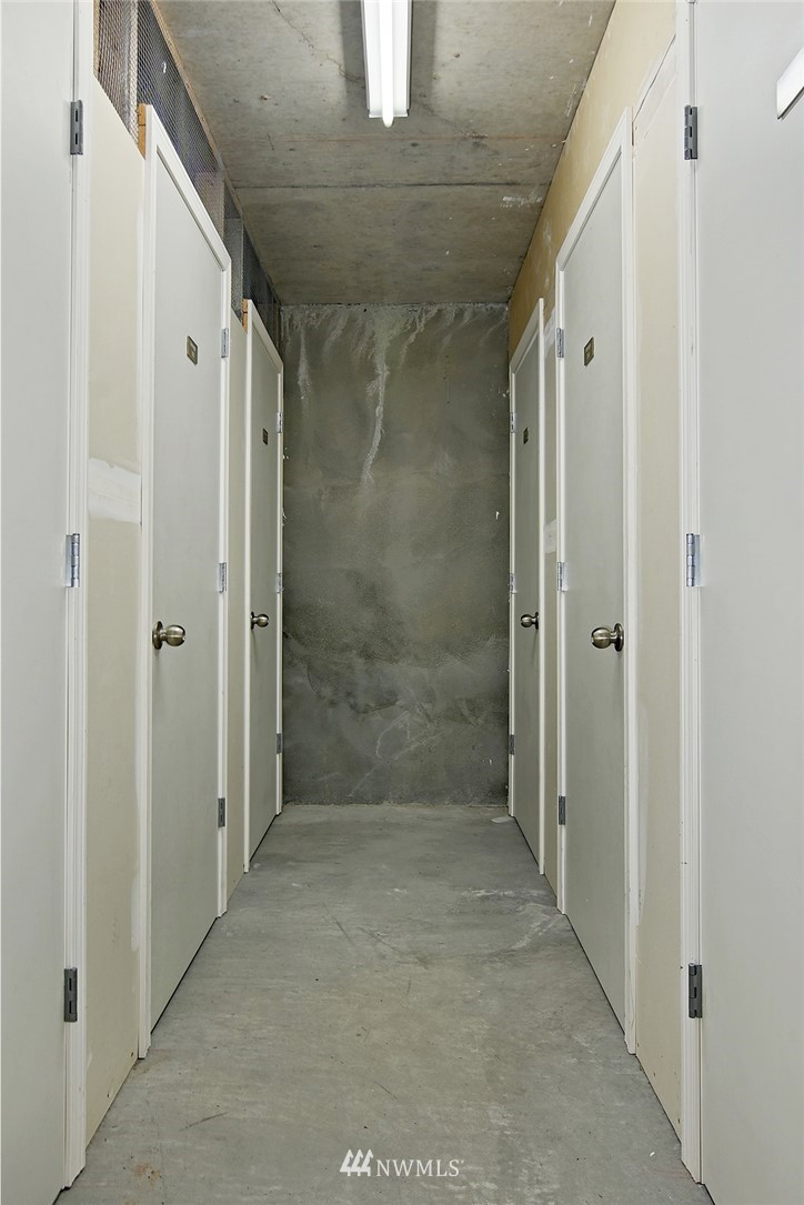 3112 Southwest Avalon Way, Unit 102 Seattle, WA 98126 - Photo 23 of 26 a bathroom with a shower and a glass door