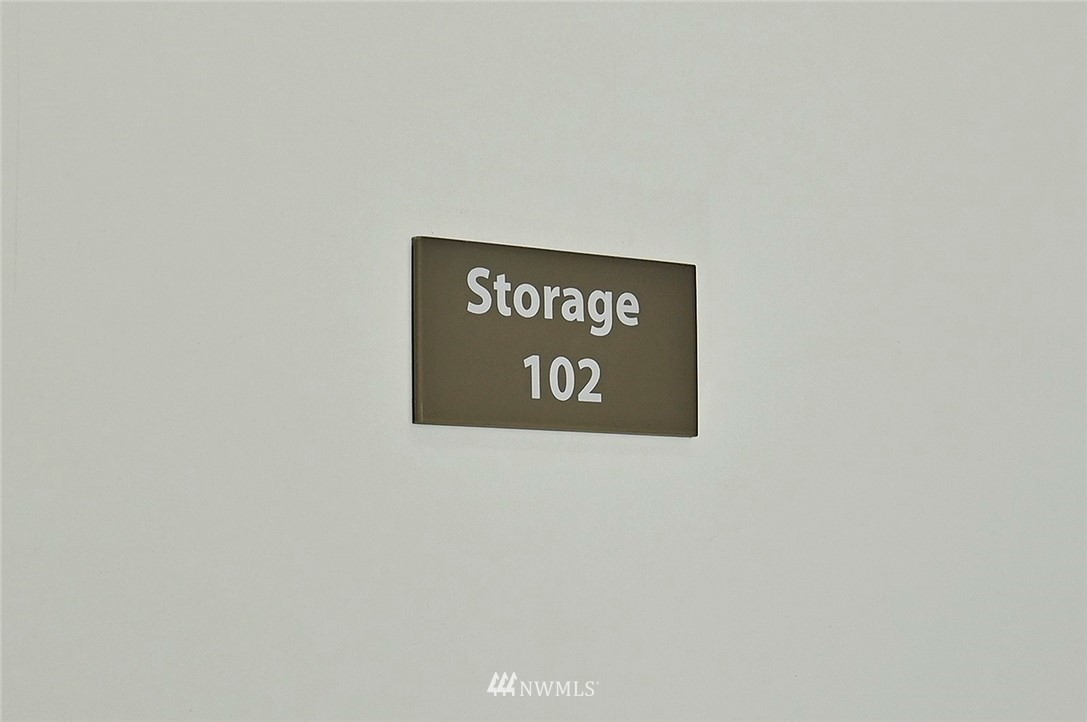 3112 Southwest Avalon Way, Unit 102 Seattle, WA 98126 - Photo 24 of 26 a wall with a sign on it