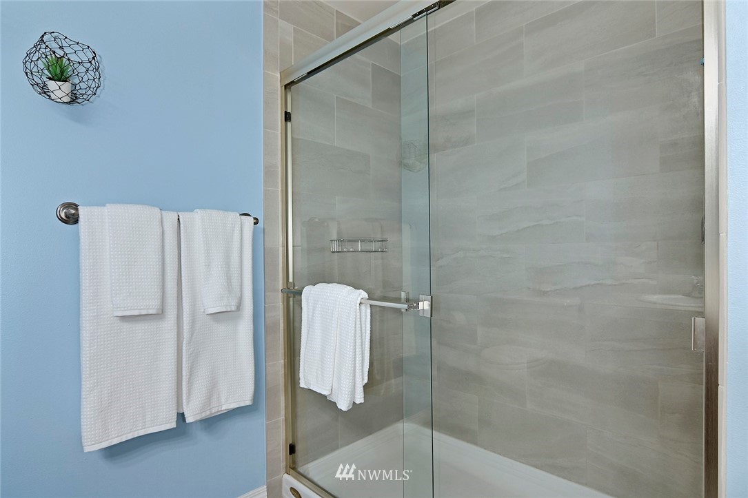 3112 Southwest Avalon Way, Unit 102 Seattle, WA 98126 - Photo 10 of 26 a bathroom with a shower
