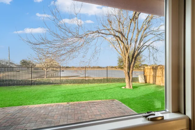 a view of a backyard with green space