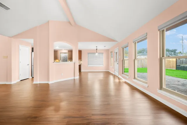 a view of an entryway with wooden floor