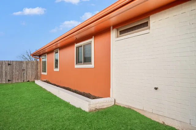 a backyard of a house with lots of green space