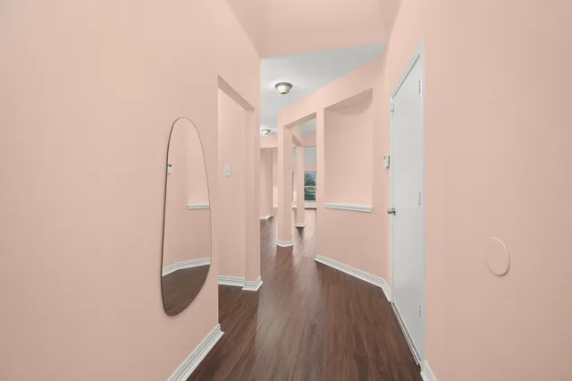 a view of a bathroom with wooden floor