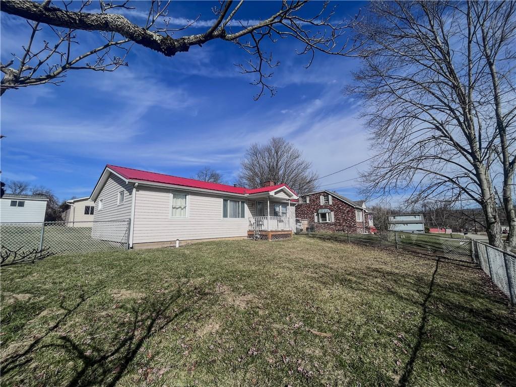 116 Pershing Drive Connellsville, PA 15425 - Photo 23 of 24 a view of a house with a yard