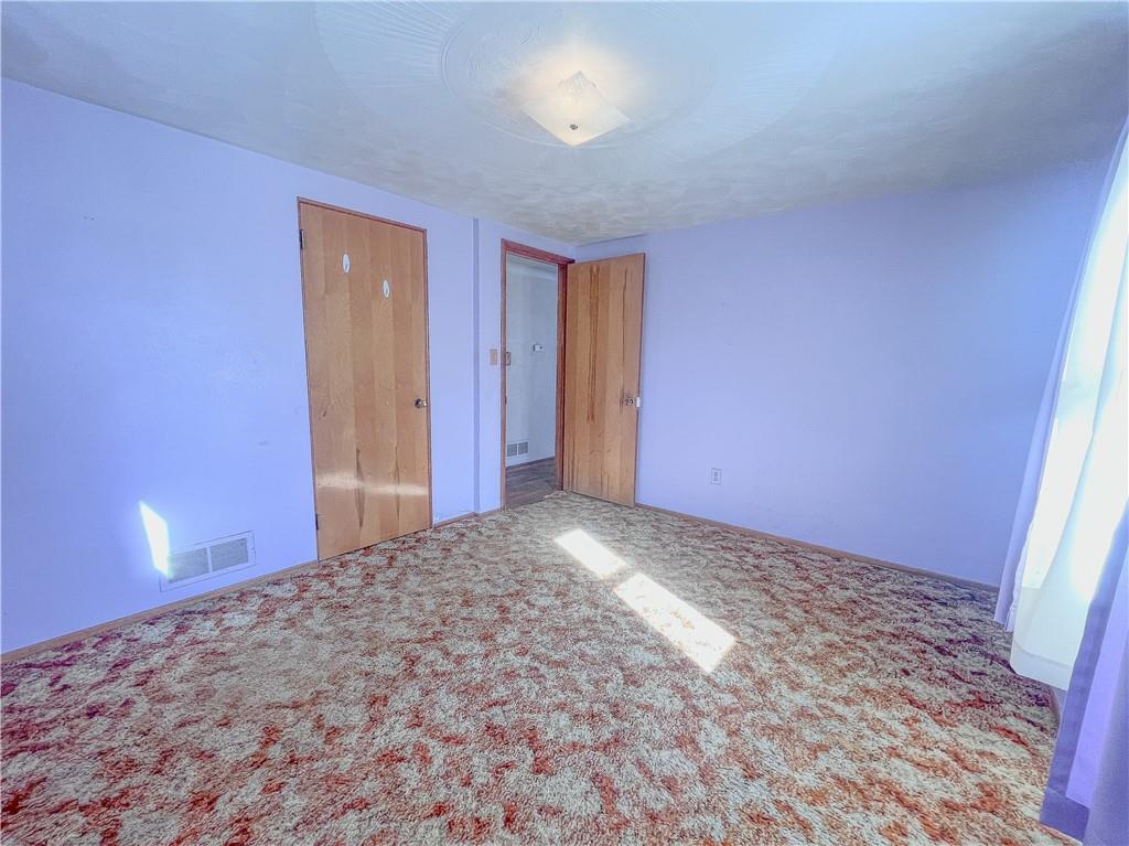 116 Pershing Drive Connellsville, PA 15425 - Photo 9 of 24 a view of an empty room and window