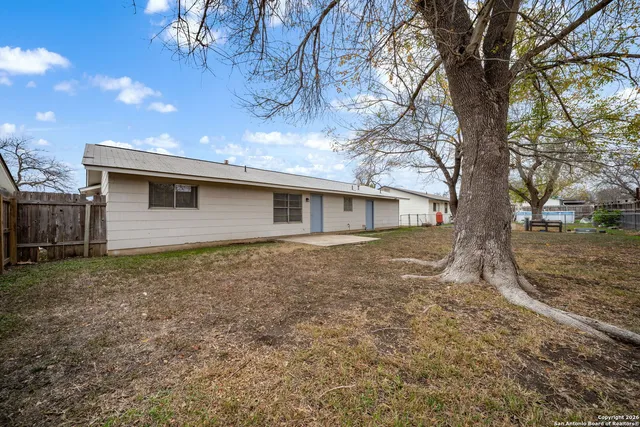 a backyard of a house with lots of green space