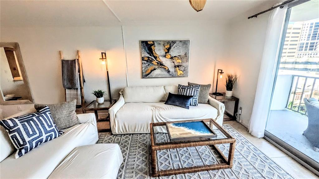 101 South Gulfstream Avenue, Unit 7E Sarasota, FL 34236 - Photo 11 of 40 a living room with furniture and a rug