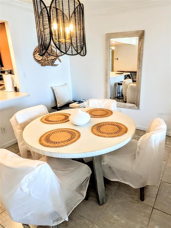 101 South Gulfstream Avenue, Unit 7E Sarasota, FL 34236 - Photo 13 of 40 a dining room table chairs and a table